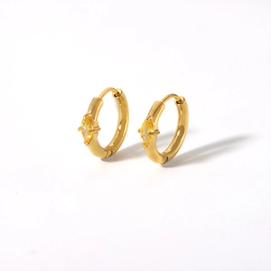 Detail view of 18K gold plated hoop earrings featuring marquise-cut yellow zircon stones