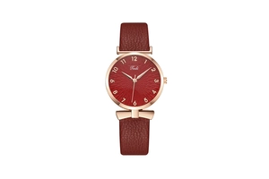 Detail of red leather strap and rose gold case on women's quartz watch with Tadi logo