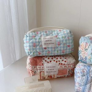 Quilted floral and plaid cotton cosmetic bags with vintage French label and zipper