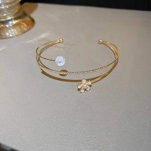 Elegant gold double-layered open bangle with white flower, pearl and crystal pave