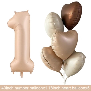 Macro shot of 40-inch number one and 18-inch heart-shaped cream matte party balloons