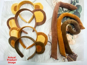 Detailed view of plush monkey ear headbands and matching tails in various brown shades