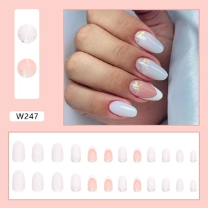 French minimalist oval press-on nails set with nude pink gradient and gold glitter accents