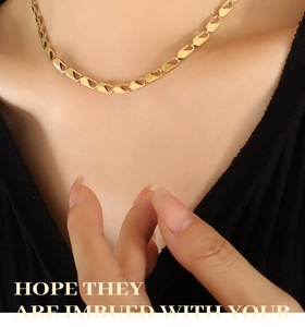 Close-up of a 18k gold-plated geometric interlocking link chain necklace on model