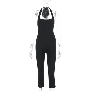 Detailed front view of black halter neck slim fit jumpsuit with elastic fabric