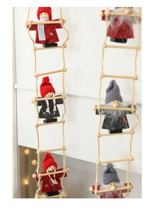 Detail of felt Santa Claus climbing on a rope ladder for Christmas tree decoration