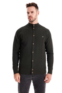 Detail of dark green waffle knit cardigan with button-up collar and premium texture