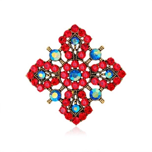 Detailed close-up of retro cross brooch with antique bronze metal and colorful crystals