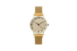Detailed macro view of the gold mesh magnetic strap and minimalist numeric watch face