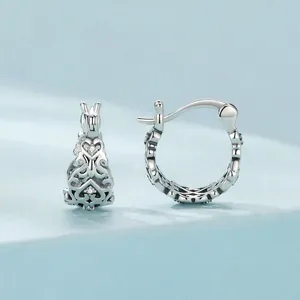 Elegant S925 sterling silver hoop earrings with hollow heart patterns and zircons