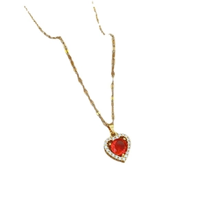 Elegant gold titanium necklace featuring a red heart pendant with white diamond accents