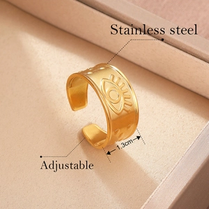 Macro view of adjustable stainless steel evil eye ring with 1.3cm band width detail