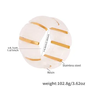 Detail view of resin and gold stainless steel wide bracelet with size and weight dimensions