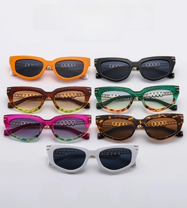 Detailed collection of cat-eye sunglasses with colorful gradient lenses and gold chain temples