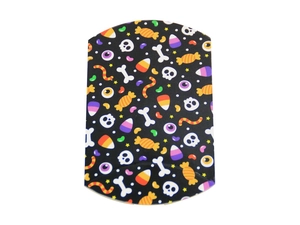 Detail of Halloween pillow box with black background and festive skull patterns