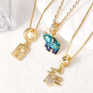 18k gold plated necklace set featuring enamel elephant, cross, and heart charms