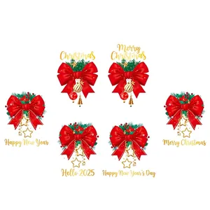 Red Christmas bow decoration with gold bells and pine needles for holiday display