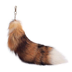 Oversized faux fox tail keychain with natural gradient fur and gold metal clasp