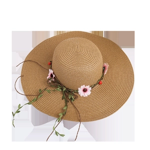 Women's wide brim straw sun hat with floral vine decoration for summer beach vacations