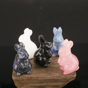 Group of five hand-carved natural crystal rabbit figurines in various colorful gemstones