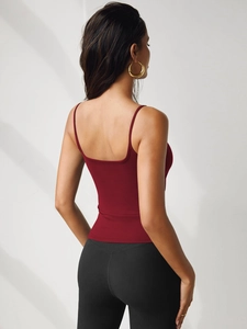 Detail view of burgundy slim fit camisole with elastic knit fabric and racerback design