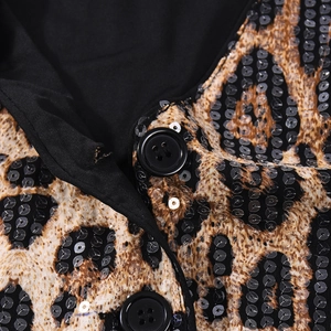 Close-up of leopard print sequin vest with black four-hole buttons and fine stitching