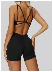 Detailed back view of black yoga bra with criss-cross straps and high waist fitness shorts