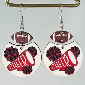 Detail view of wood cheer earrings with football and megaphone patterns on metal hooks