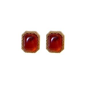 Vintage style square stud earrings with amber resin stone and golden filigree frame