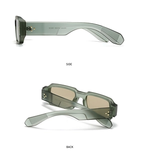 Detail view of dark green acetate frame with golden triple-stud rivets on temples