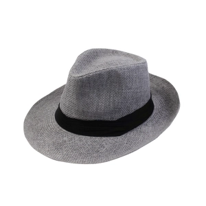 Panama straw hat with wide brim and black ribbon for elegant sun protection at the beach