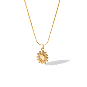 Detail of 18K gold stainless steel necklace with oval pendant and small crystals