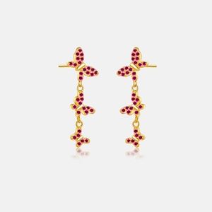 Macro view of triple butterfly drop earrings in gold with pink micro-pave crystals
