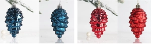 Close-up of blue and red pine cone Christmas ornaments with a shiny metallic finish