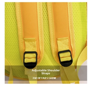 Close-up of adjustable yellow canvas shoulder strap and breathable mesh back panel