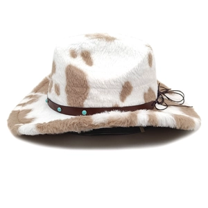 Detail of cow print faux fur cowboy hat with turquoise studded leather band and soft texture