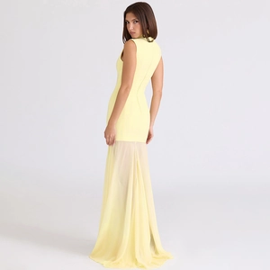 Detail of pale yellow strapless gown featuring sheer tulle fishtail hem and slim fit
