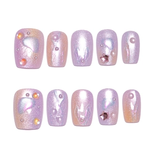 Purple cat eye press-on nails with mermaid pearls and metallic star accents
