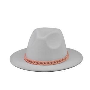 Detail of white wool felt boater hat with a stylish pink thick resin chain band