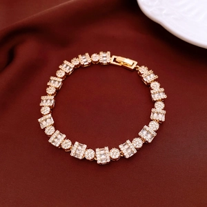 Detail shot of 18k gold plated bracelet with clear zircon stones on velvet