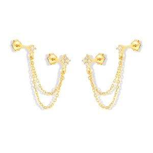 Detail of gold-plated silver chain studs featuring sparkling zircon stones for double piercings