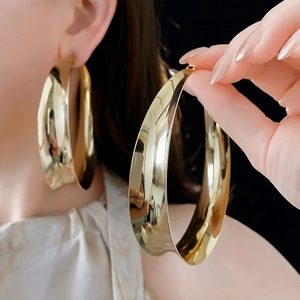 Polished chunky gold hoop earrings with minimalist circular design for women