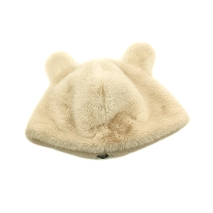 Detail shot of plush beige faux fur hat featuring cute 3D bear ears and soft texture