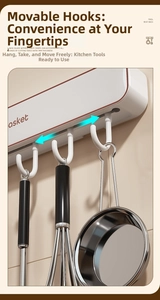 Close-up of wall-mounted kitchen rack with movable hooks holding stainless steel cookware
