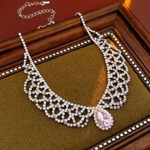 Detail of teardrop pink gemstone necklace with sparkling crystal lace mesh design