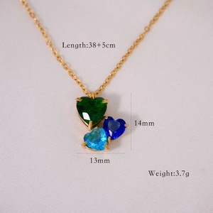 Detailed close-up of 14k gold plated heart necklace with tricolor zircon gemstones