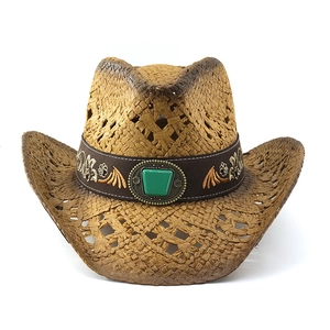 Detailed embroidery on straw hat band with green stone and vintage metal rivets