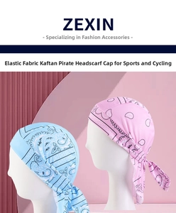 Pink and sky blue paisley pirate headbands shown on mannequin heads for cycling sports