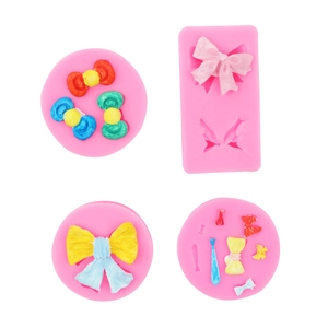 Detailliertes Gitter aus rosa Silikon-Schleifenformen mit farbigen Fondant-Ergebnissen