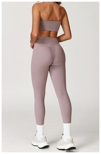 Detail view of high-waist lilac yoga leggings and strapless top from the back